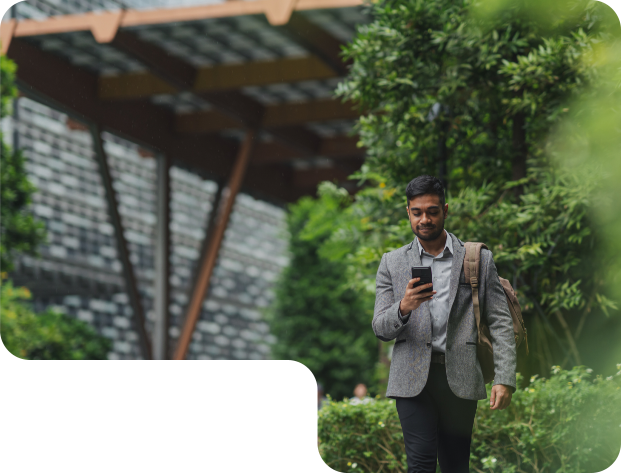 Resident using a phone outdoors at a development