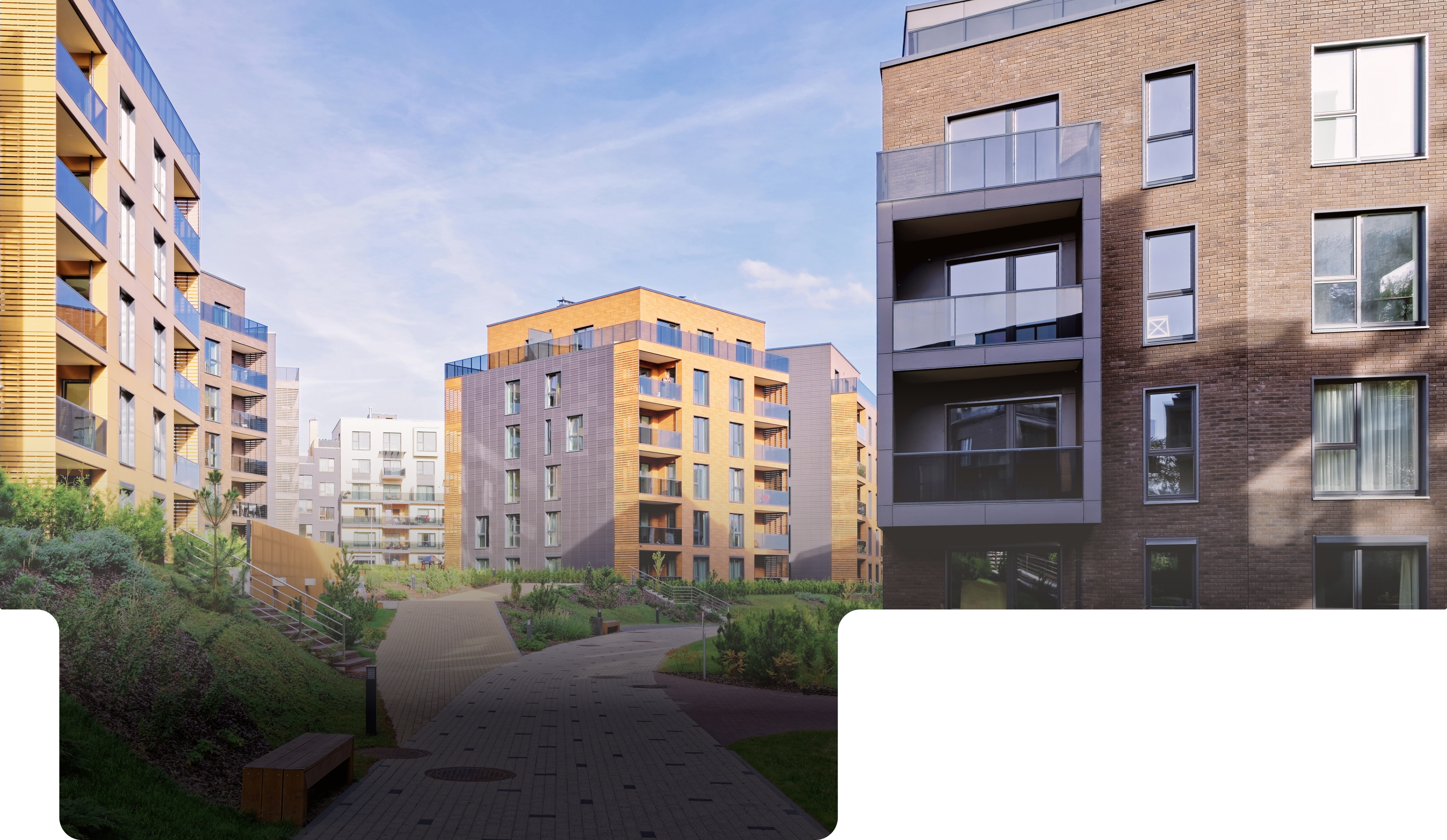 Modern brick apartment courtyard with landscaped gardens