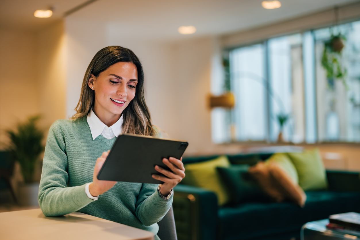 Resident reviewing plans on a tablet in a lounge